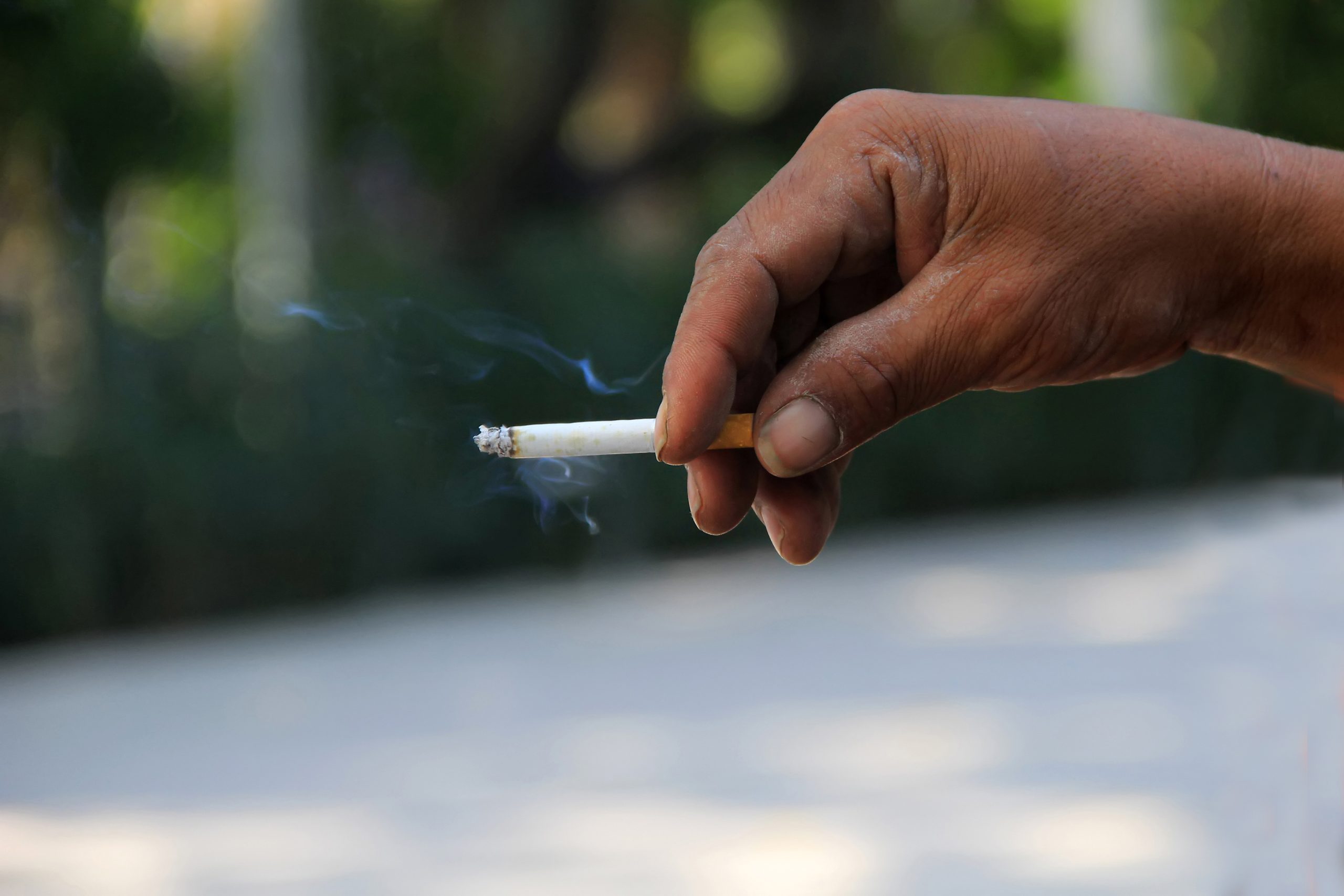man-s-hand-holds-cigarette-that-is-burning_1